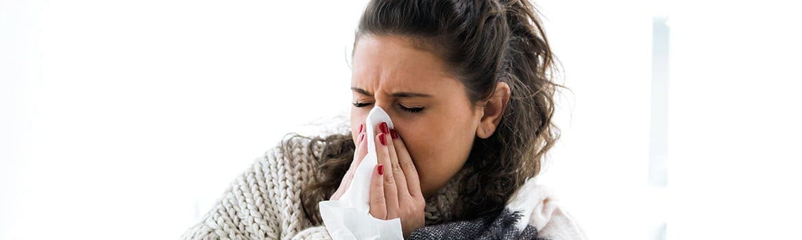 A woman suffering from a cold