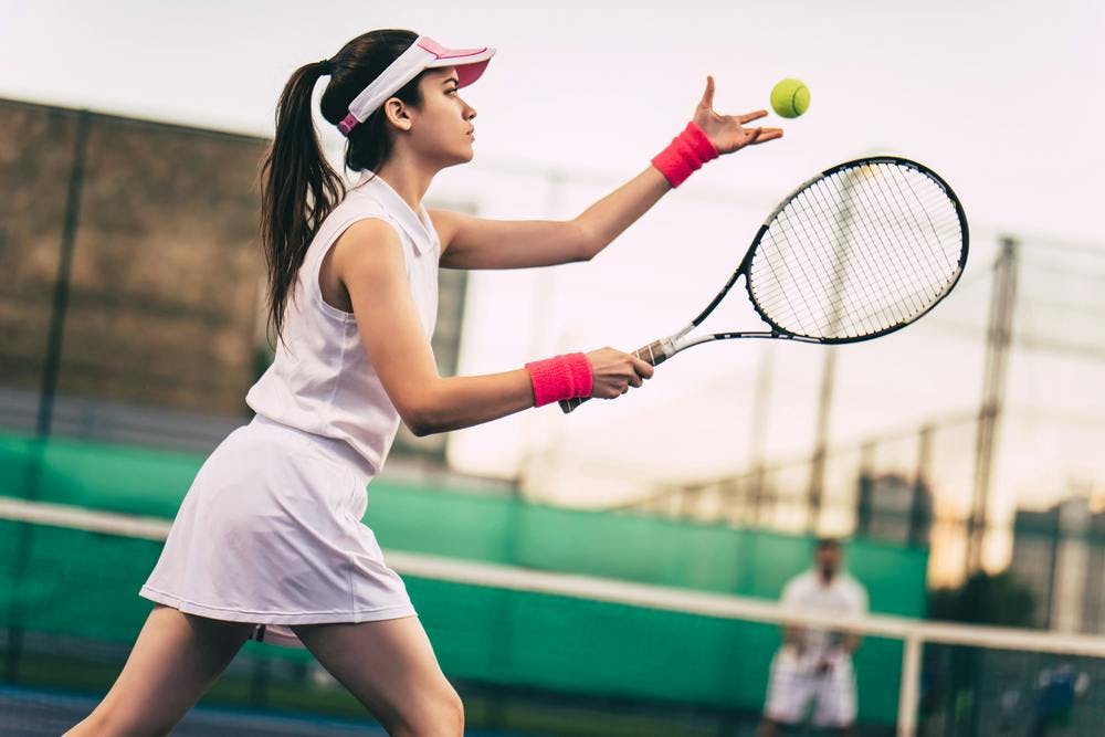 A girl playing tennis