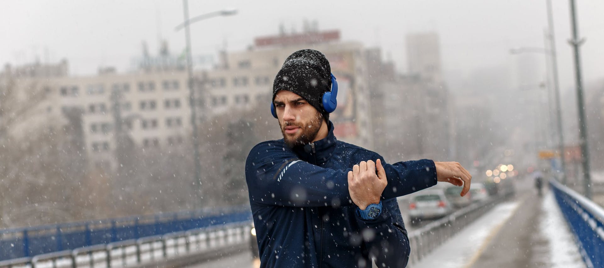 A man exercising outdoors in snow