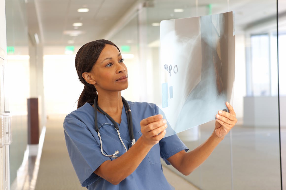 Physician looking at X-ray